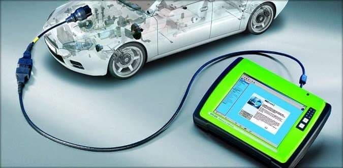 Diagnostic tablet plugged into a car